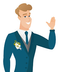 Image showing Young caucasian groom waving his hand.