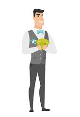 Image showing Happy caucasian groom holding money.