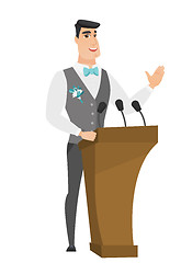 Image showing Caucasian groom giving a speech from tribune.