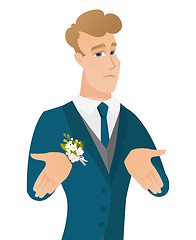Image showing Young caucasian confused groom shrugging shoulders
