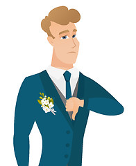 Image showing Disappointed caucasian groom with thumb down.