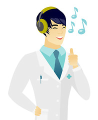 Image showing Asian doctor listening to music in headphones.