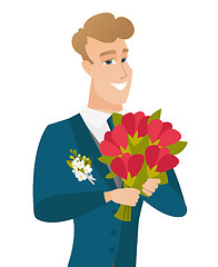 Image showing Young caucasian groom with bridal bouquet.