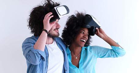 Image showing multiethnic couple getting experience using VR headset glasses