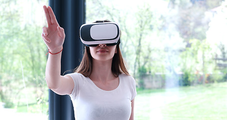 Image showing woman using VR-headset glasses of virtual reality