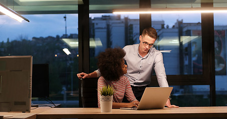 Image showing Multiethnic startup business team in night office