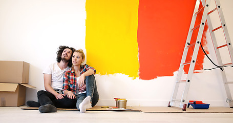 Image showing Happy young couple relaxing after painting