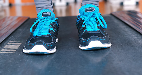 Image showing black female feet in sneakers