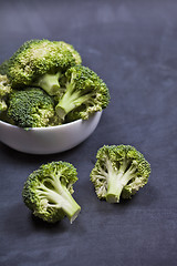 Image showing Fresh green organic broccoli in white bowl.