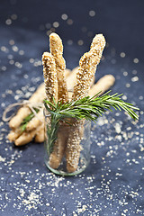 Image showing Italian grissini or salted bread sticks with sesame and rosemary