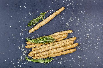 Image showing Italian grissini or salted bread sticks with sesame and rosemary