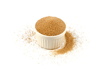 Image showing Brown cane sugar in ceramic bowl isolated on white background. 