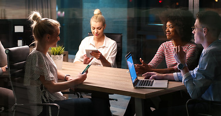 Image showing Multiethnic startup business team in night office