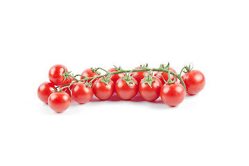 Image showing Fresh organic cherry tomatoes bunch isolated on white.