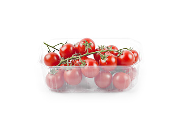 Image showing Fresh organic cherry tomatoes bunch onplastic container isolated