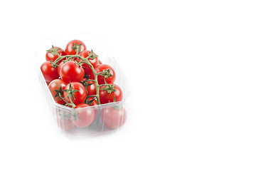 Image showing Fresh organic cherry tomatoes bunch onplastic container isolated