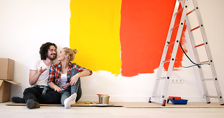 Image showing Happy young couple relaxing after painting