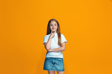 Image showing Young serious thoughtful teen girl. Doubt concept.