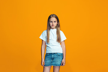 Image showing Young serious thoughtful teen girl. Doubt concept.