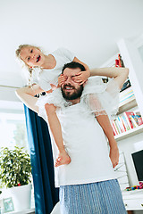 Image showing Father and his six years kid girl at home