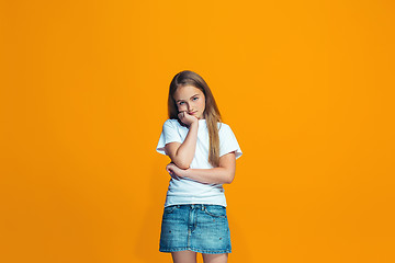 Image showing Young serious thoughtful teen girl. Doubt concept.