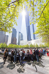 Image showing Tourists visiting 9 11 memorial park in downtown Manhattan, located on the site as the original World Trade Center.