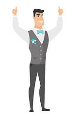 Image showing Groom standing with raised arms up.