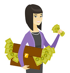 Image showing Asian business woman with briefcase full of money.