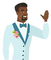 Image showing Young african-american groom waving his hand.