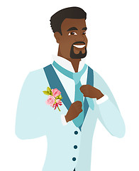 Image showing Cheerful african-american groom adjusting tie.