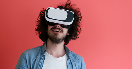 Image showing young man using VR headset glasses of virtual reality