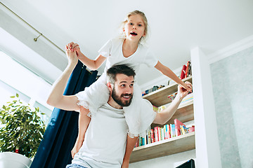 Image showing Father and his six years kid girl at home