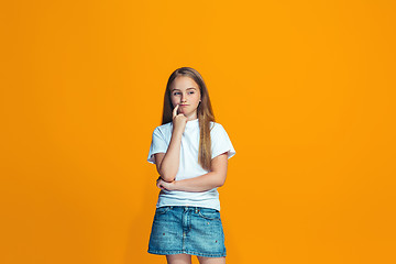 Image showing Young serious thoughtful teen girl. Doubt concept.