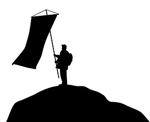 Image showing Man standing on mountain top and holding large flag