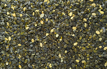 Image showing pumpkeen seeds scattered over stone board