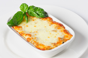 Image showing Fresh hot lasagna on white