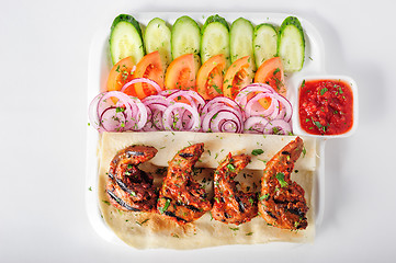 Image showing Grilled lamb tongues with fresh vegetables salad