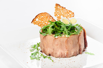 Image showing tasty appetizer with sliced veal tongue and riuccola