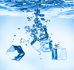 Image showing Ice cubes falling under water