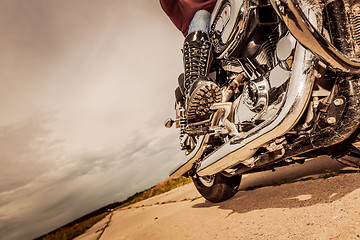 Image showing Biker girl riding on a motorcycle