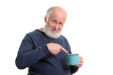 Image showing unhappy elderly man with cup of bad tea or coffee isolated on white