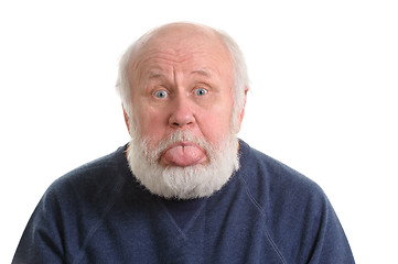 Image showing senior man with sticking tongue out, isolated portrait