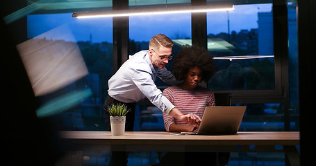 Image showing Multiethnic startup business team in night office