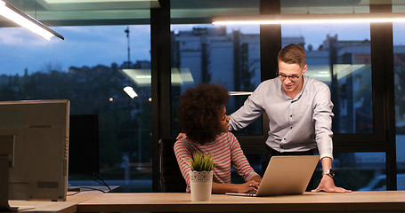 Image showing Multiethnic startup business team in night office