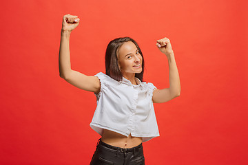 Image showing Winning success woman happy ecstatic celebrating being a winner. Dynamic energetic image of female model