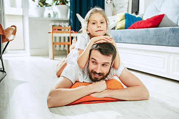 Image showing Father and his six years kid girl at home