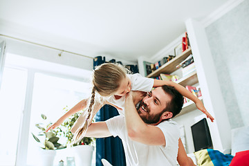 Image showing Father and his six years kid girl at home