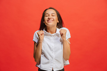 Image showing Winning success woman happy ecstatic celebrating being a winner. Dynamic energetic image of female model