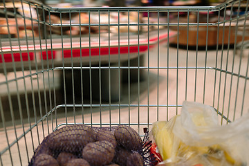 Image showing view from the shopping cart. product in the supermarket trolley.