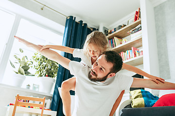 Image showing Father and his six years kid girl at home